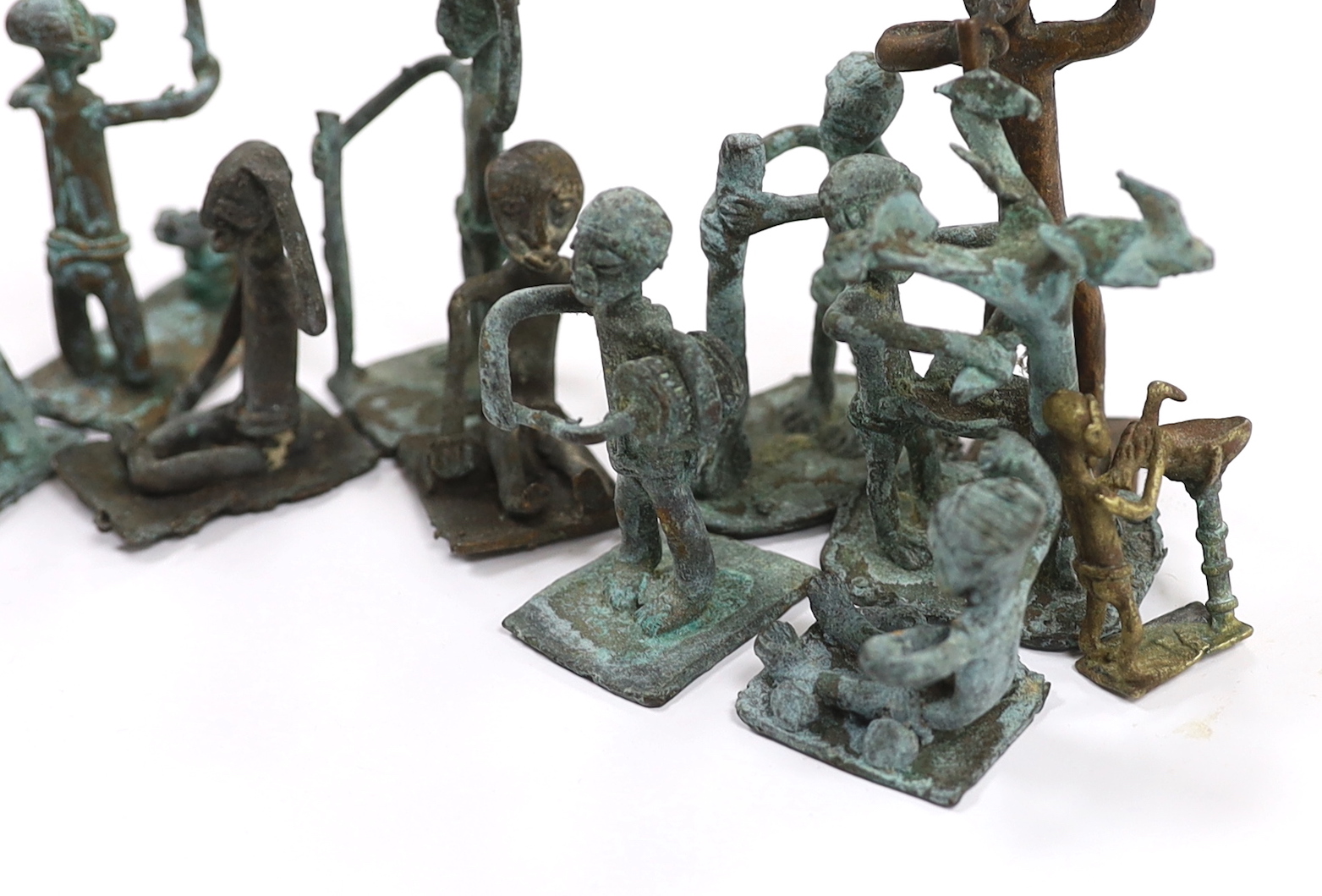A collection of 20th century West African bronze figures, possibly gold weights, Ghana, Akan, box inscribed ‘West Africa. Gold Coast - attained in 1944 (Ghana)’, tallest 8.5cm